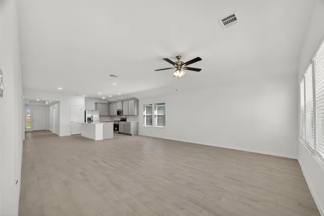a view of a livingroom with a kitchen