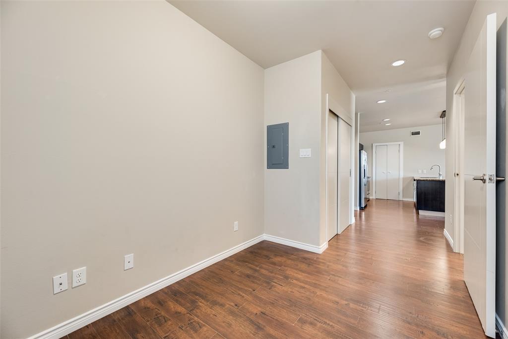 1100 West Trinity Mills Road, Unit 2040 Carrollton, TX 75006 - Photo 10 of 21 a view of a hallway with wooden floor