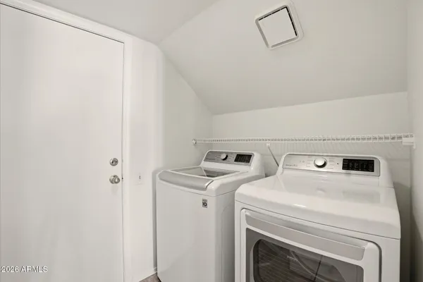 a utility room with dryer and washer