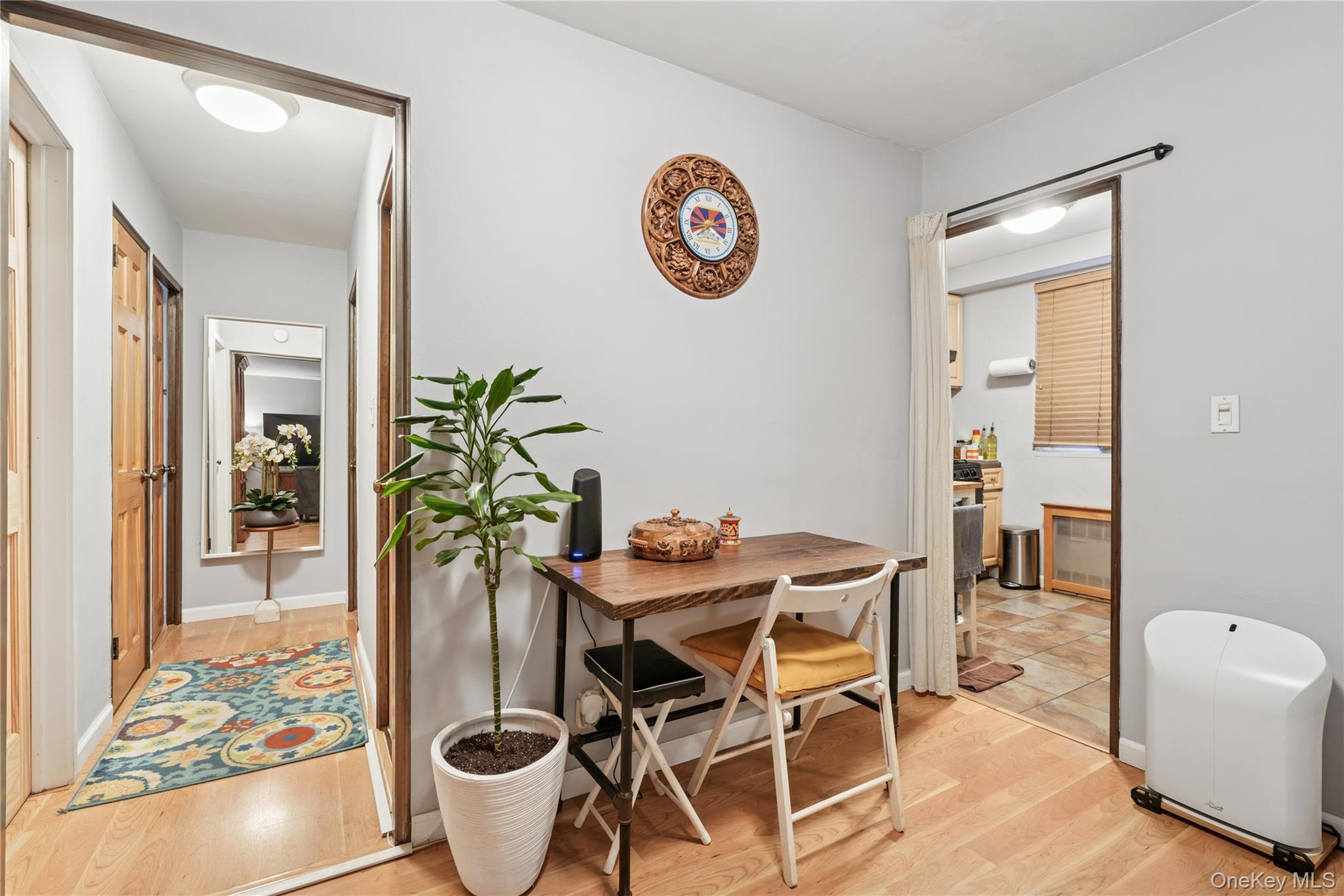 35-50 85th Street, Unit 3D Queens, NY 11372 - Photo 8 of 15 a dining room with furniture and a potted plant