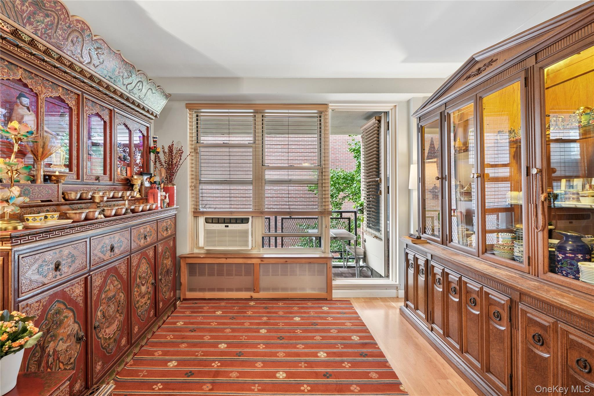 35-50 85th Street, Unit 3D Queens, NY 11372 - Photo 9 of 15 a view of a living room and kitchen with furniture