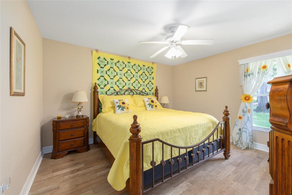 18825 Southwest 93rd Loop Dunnellon, FL 34432 - Photo 29 of 85 a bed sitting in a bedroom next to a window