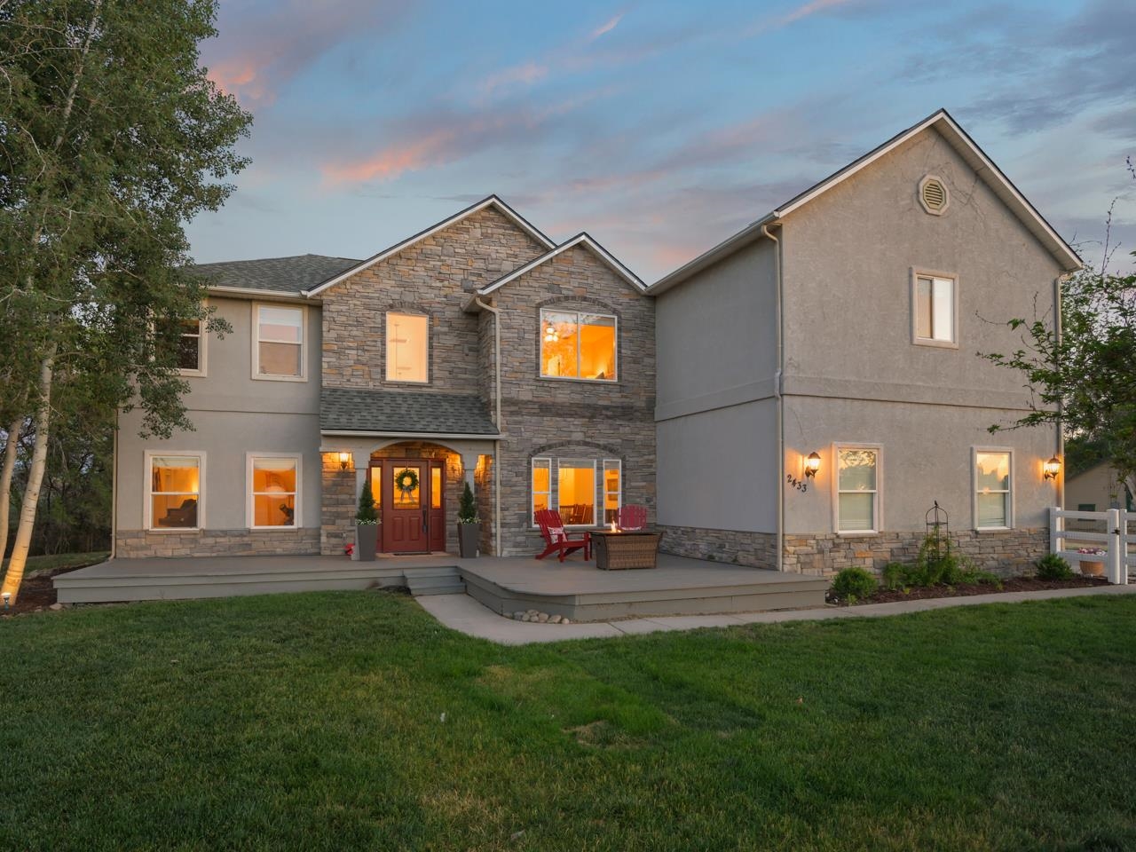 2433 H Road Grand Junction, CO 81505 - Photo 1 of 42 a front view of a house with a yard and garage