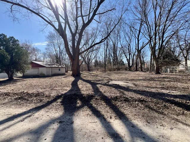 a view of a yard covered with snow