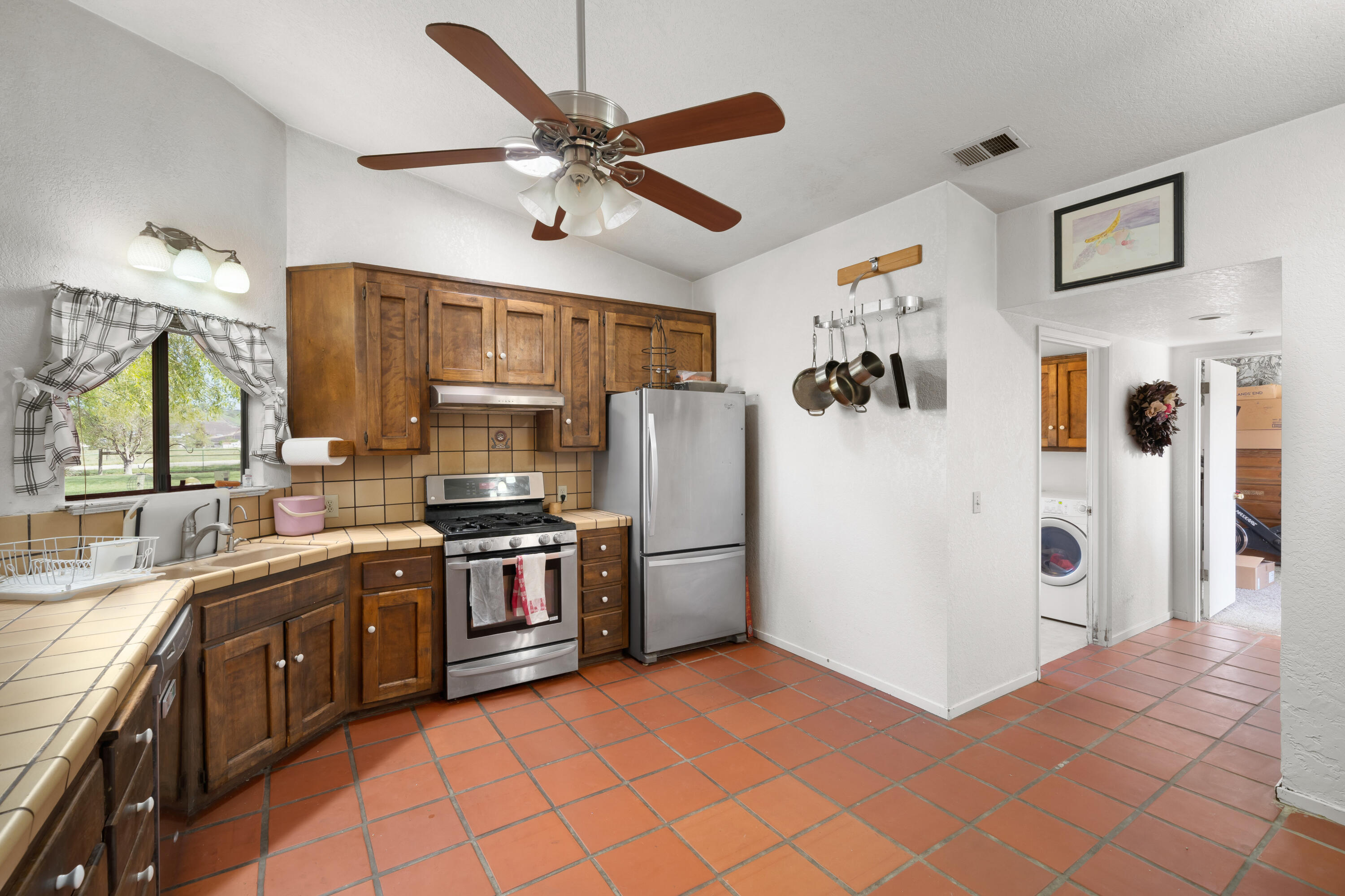 7595 Feenstra Road Paso Robles, CA 93446 - Photo 9 of 43 a kitchen with stainless steel appliances granite countertop a refrigerator and a sink