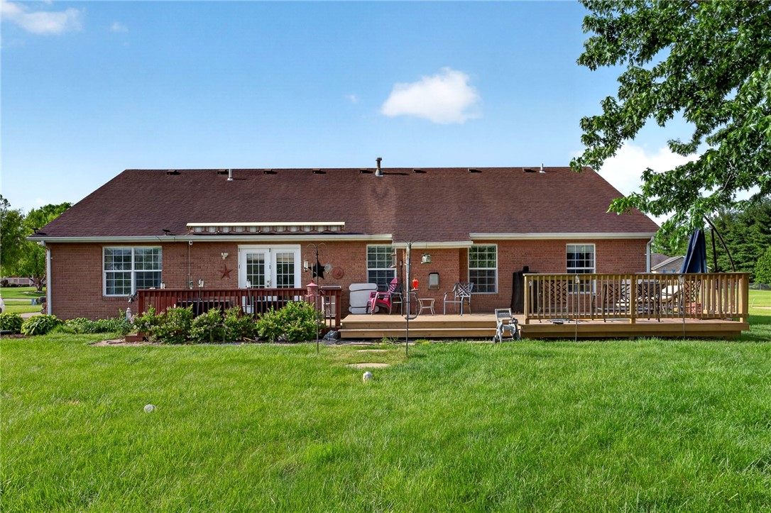 4996 Shannon Avenue Springfield, OH 45504 - Photo 11 of 61 This spacious yard features a lovely brick home with a large wooden deck perfect for outdoor enjoyment.