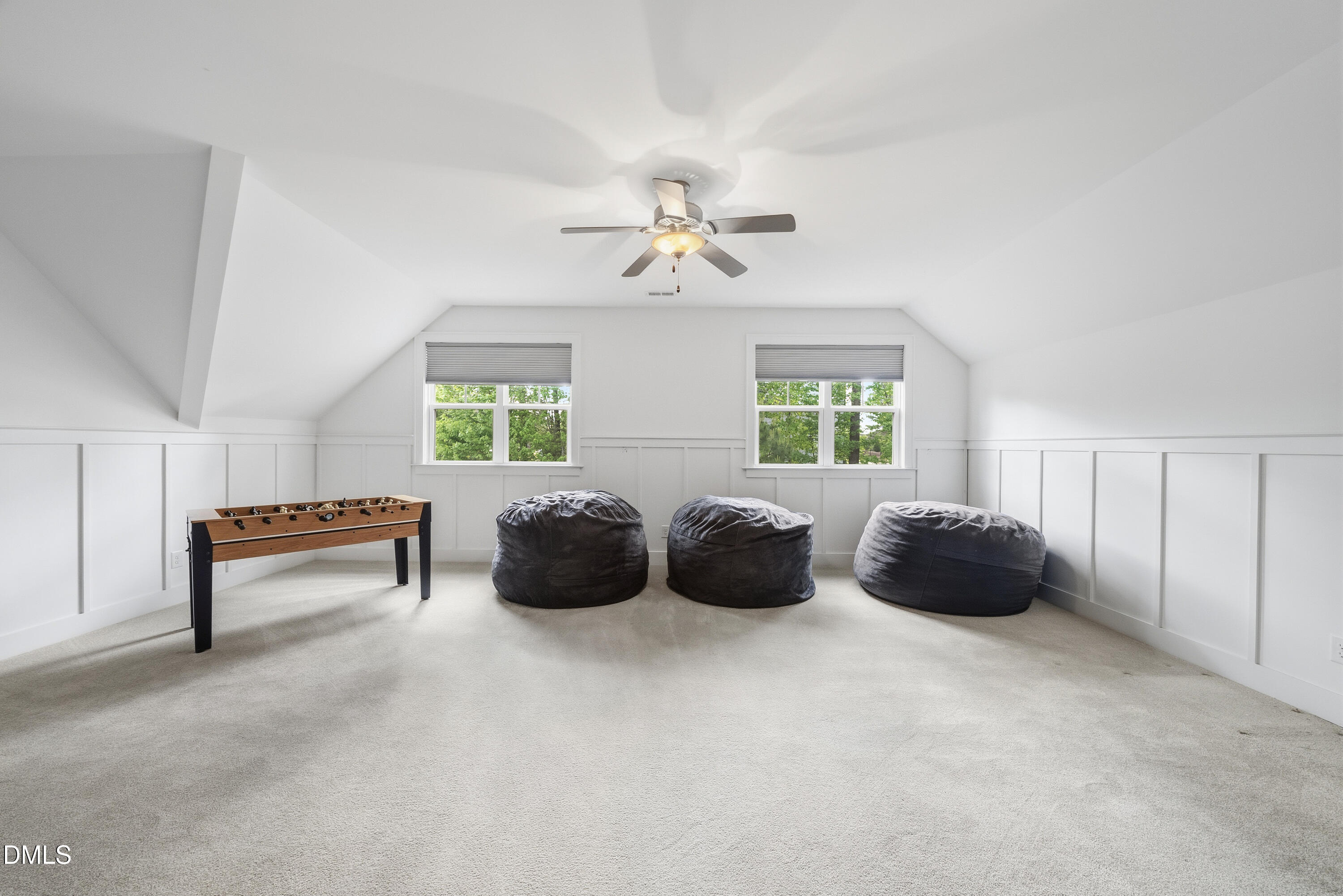 5109 Wainscott Way Raleigh, NC 27612 - Photo 33 of 52 a living room with furniture and a chandelier