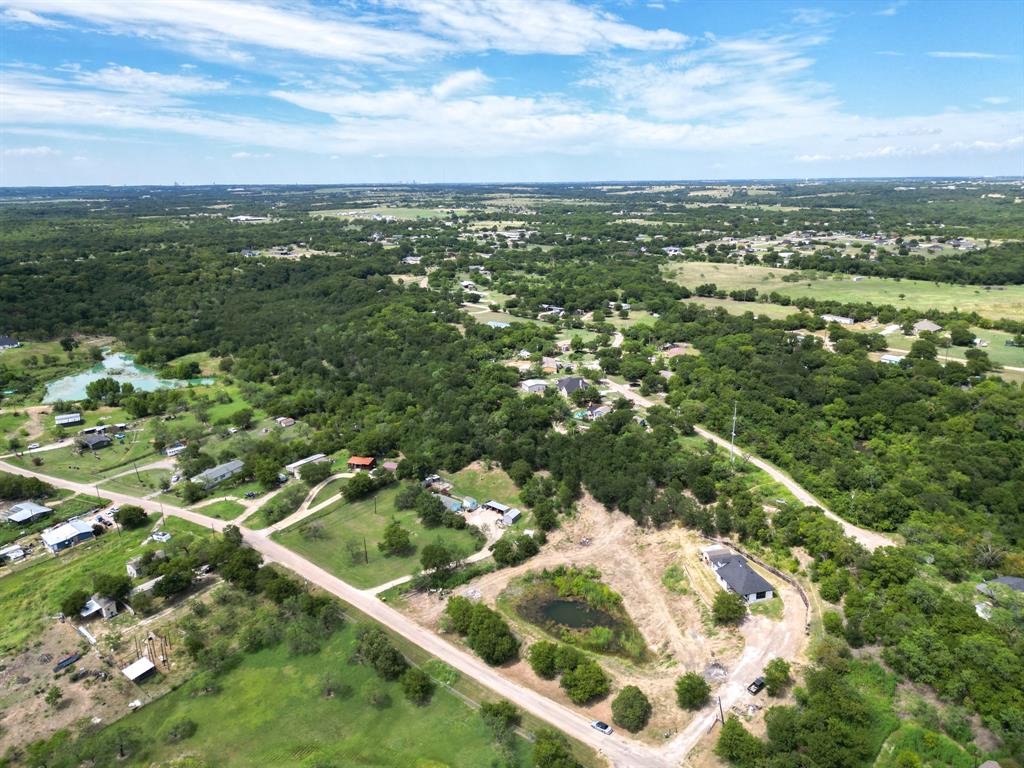 441 Mesa Road Waxahachie, TX 75167 - Photo 6 of 11 Drone / aerial view of a heavily wooded area