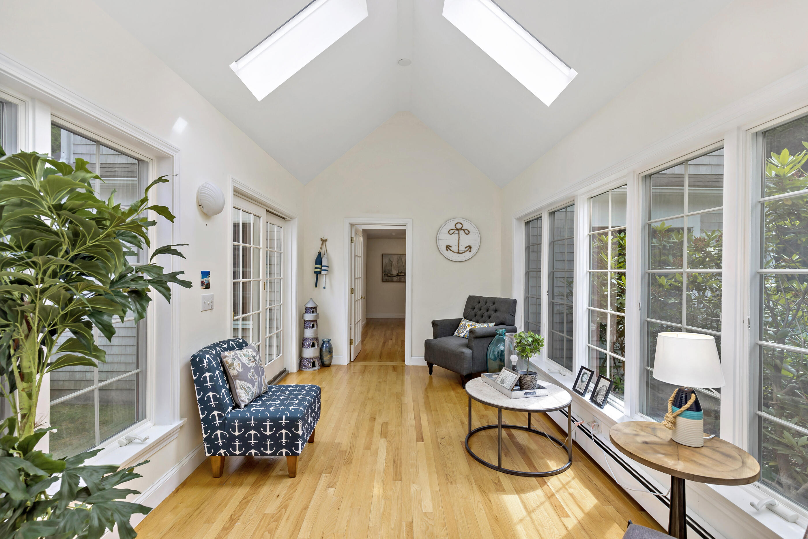 414 Eel River Road Osterville, MA 02655 - Photo 18 of 40 a living room with furniture dining table and a potted plant