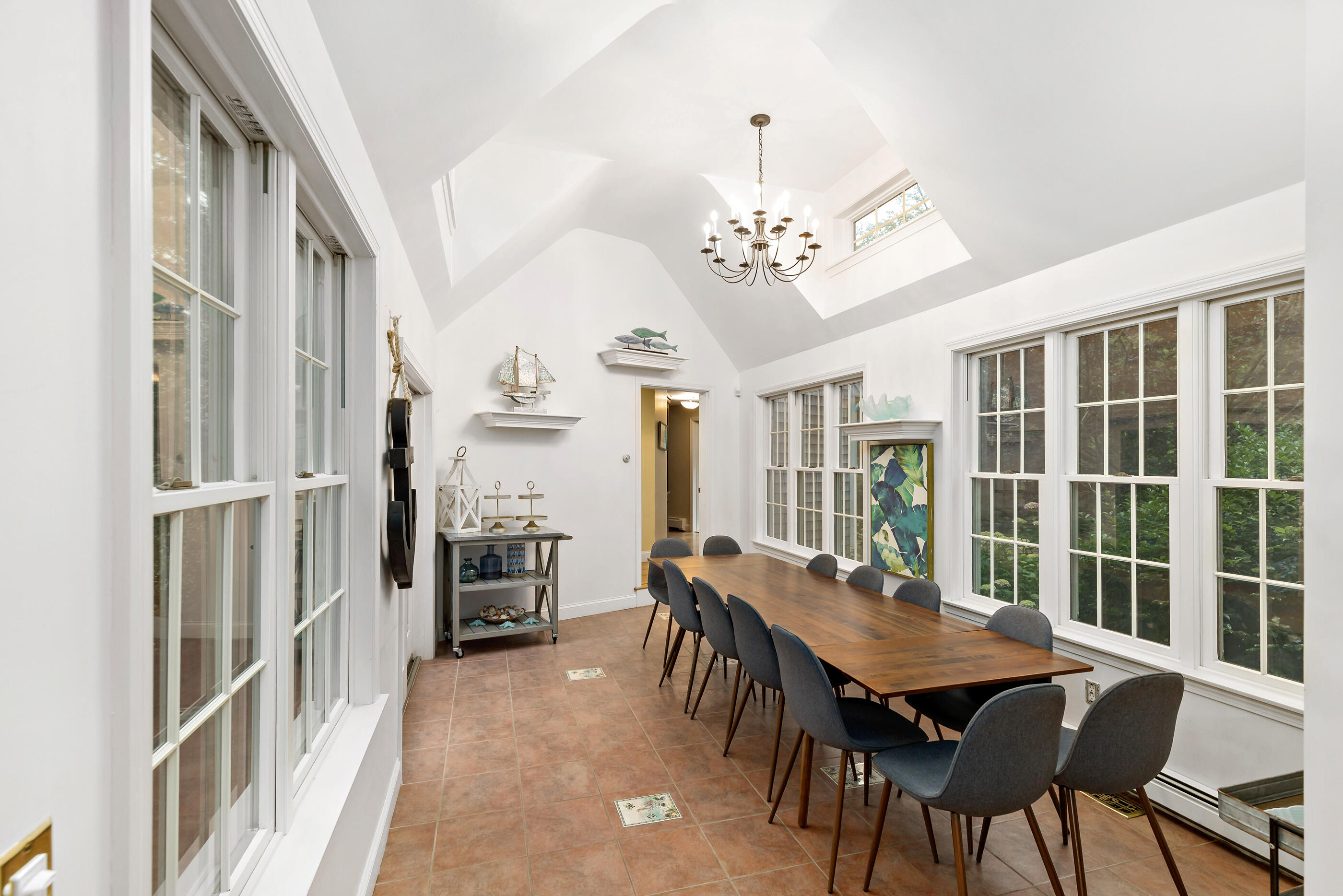 414 Eel River Road Osterville, MA 02655 - Photo 19 of 40 a view of a dining room with furniture window and wooden floor