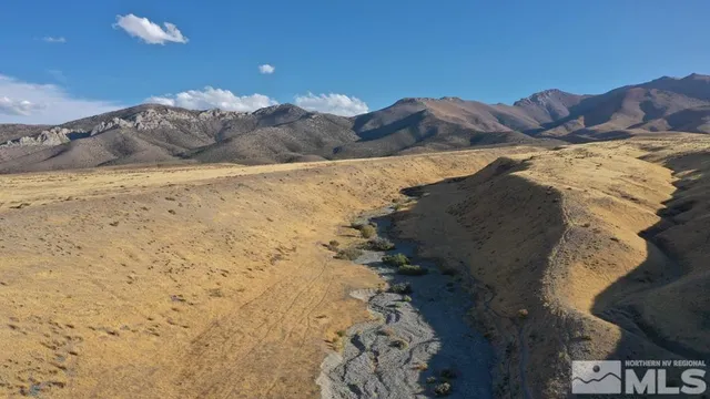 a view of ocean with a mountain
