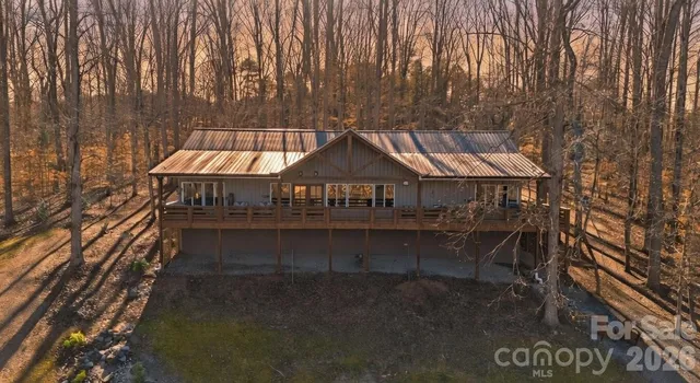 a bedroom with a bed and ceiling fan