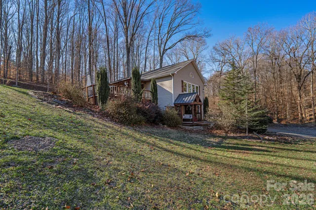 a view of a chairs and table in the balcony