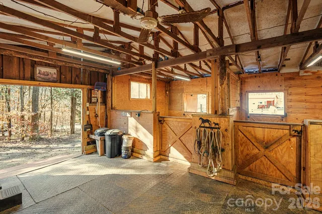 a view of backyard with table and chairs