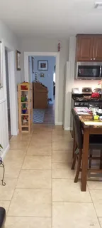 a kitchen with a stove and a refrigerator