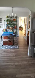 a view of living room with furniture and flat screen tv