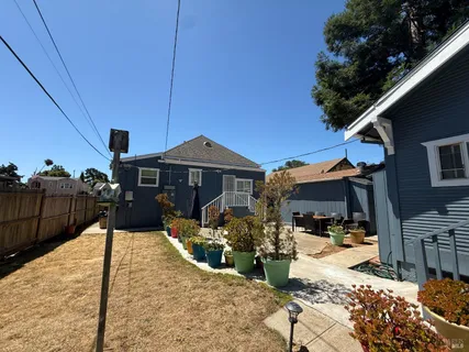 a wooden bench sitting in front of a building