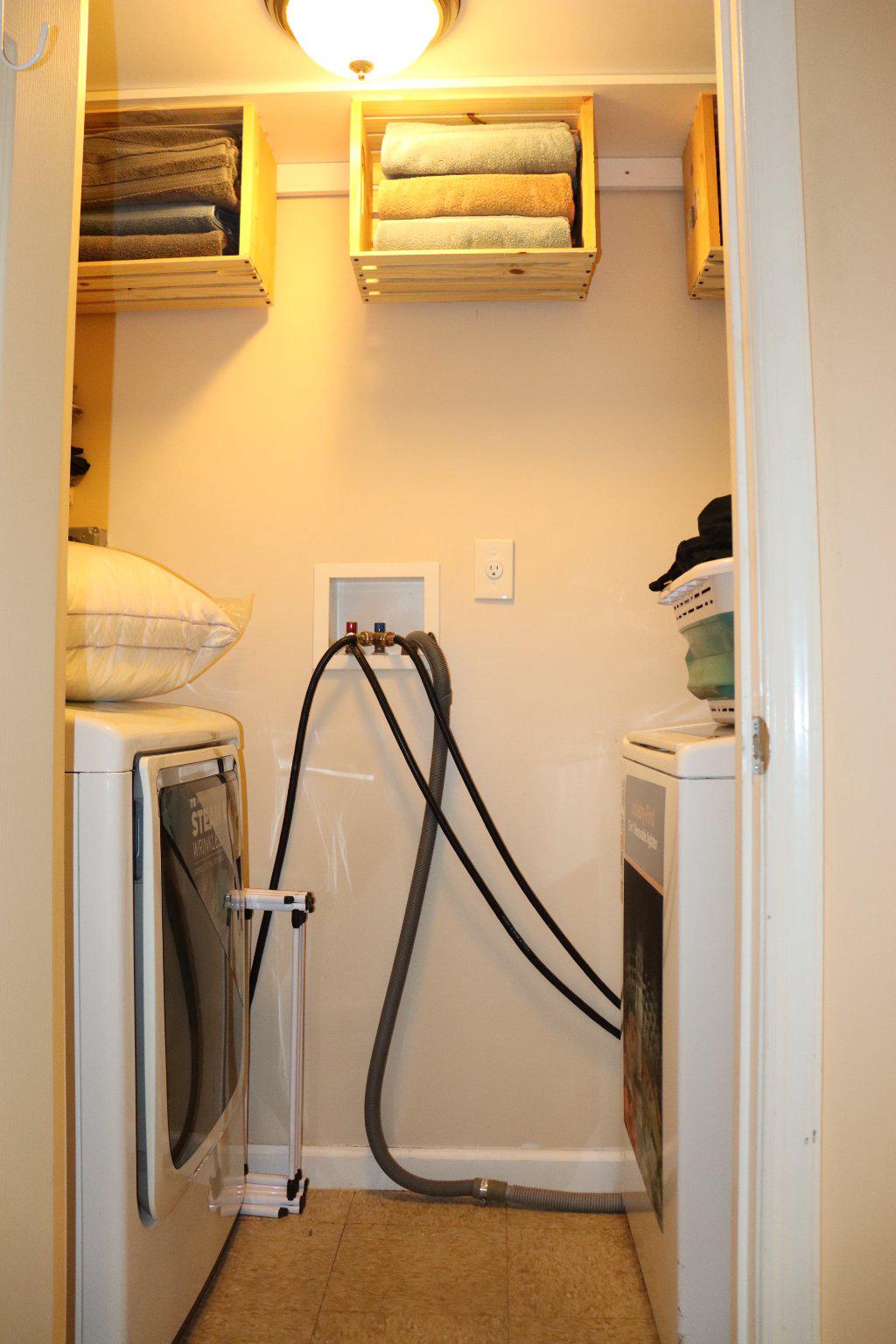 1328 Cedarcroft Road Baltimore, MD 21239 - Photo 32 of 39 Washer and dryer with built-in shelving storage.