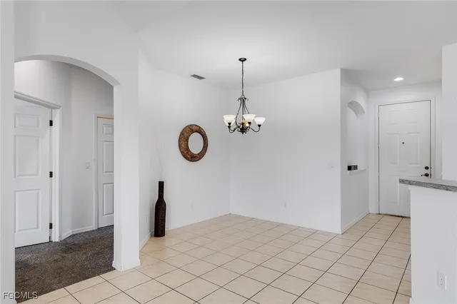 a bathroom with a double vanity sink mirror and shower