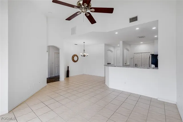 a bathroom with a sink a toilet a mirror and shower