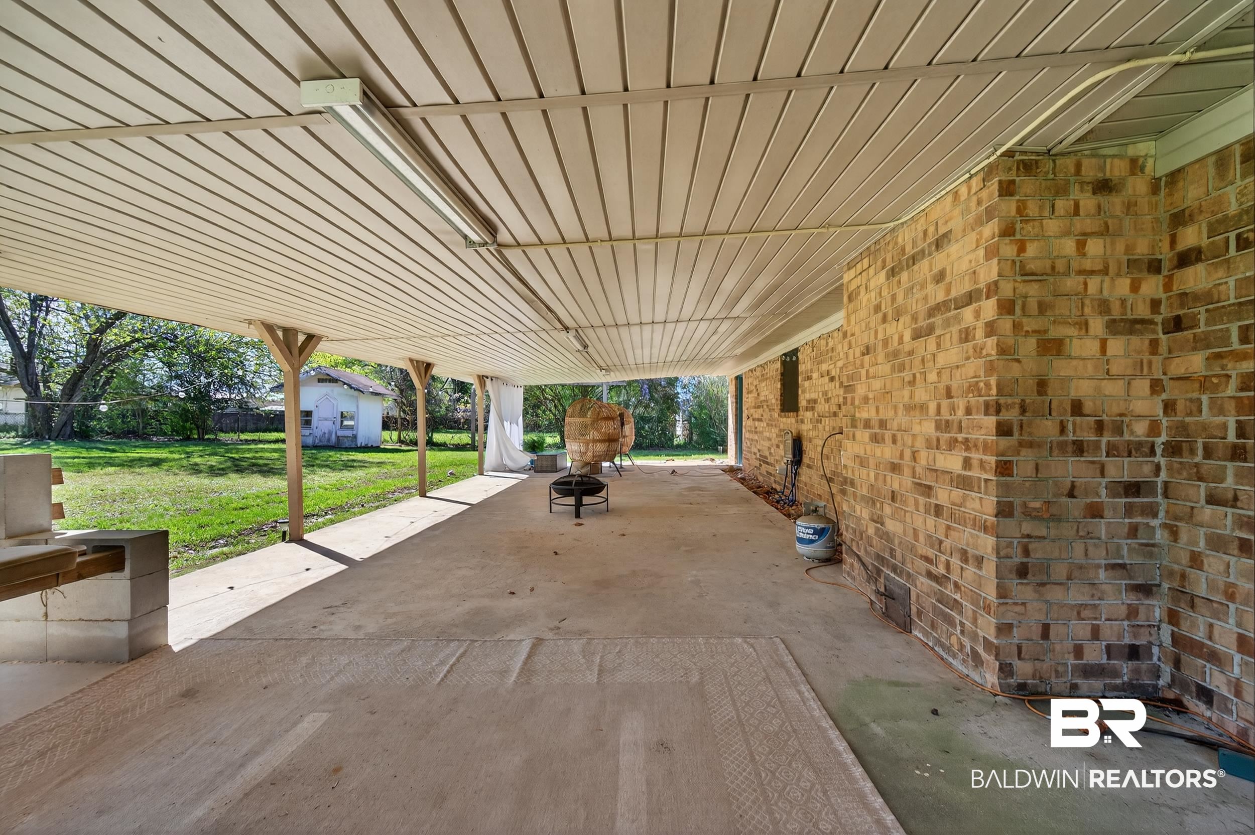 46006 Pecan Lane Bay Minette, AL 36507 - Photo 29 of 40 View of patio with an outdoor fire pit and a shed