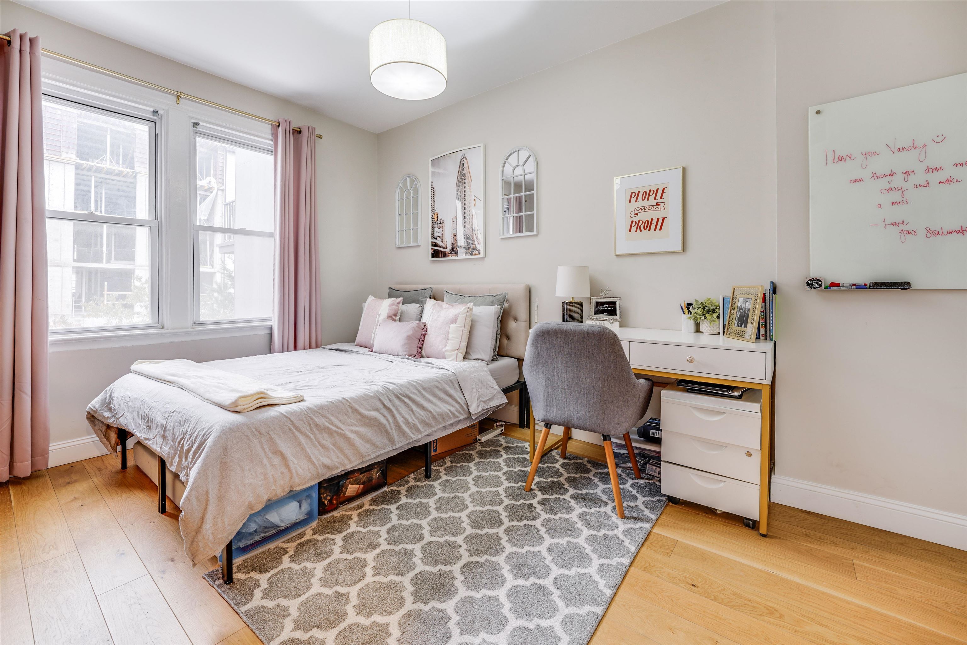 709 Monroe Street, Unit 2 Hoboken, NJ 07030 - Photo 15 of 22 a bedroom with a bed and chair
