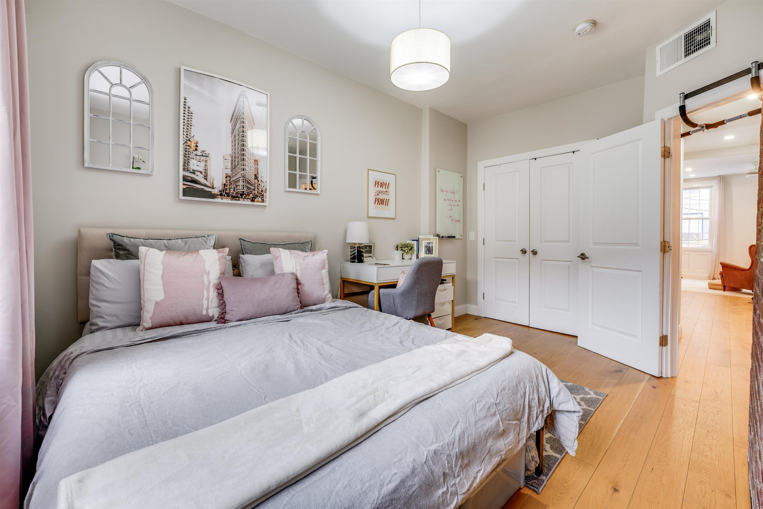 709 Monroe Street, Unit 2 Hoboken, NJ 07030 - Photo 16 of 22 a bedroom with a large bed and wooden floor