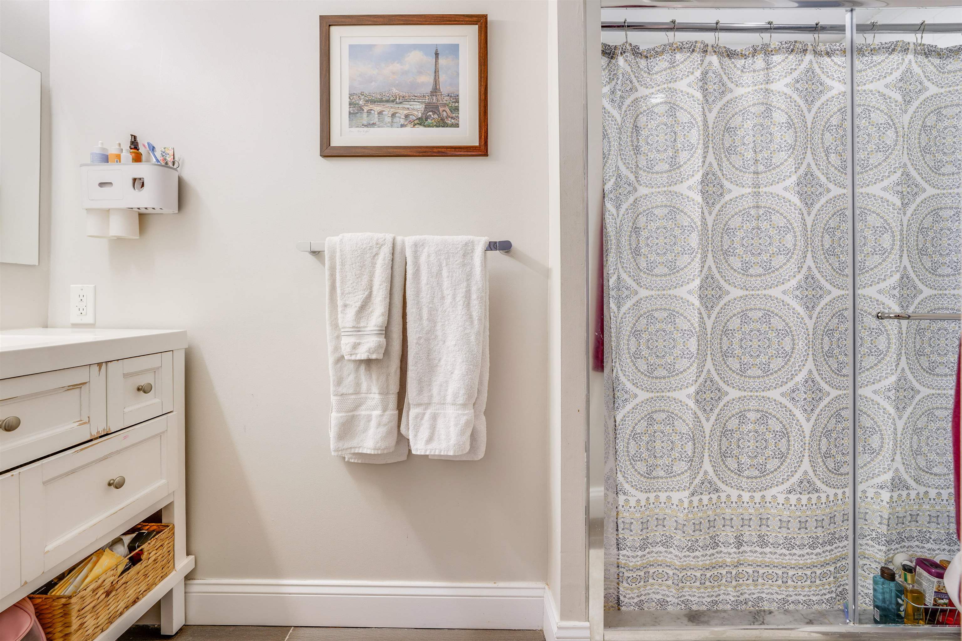 709 Monroe Street, Unit 2 Hoboken, NJ 07030 - Photo 21 of 22 a bathroom with a shower curtain and a sink