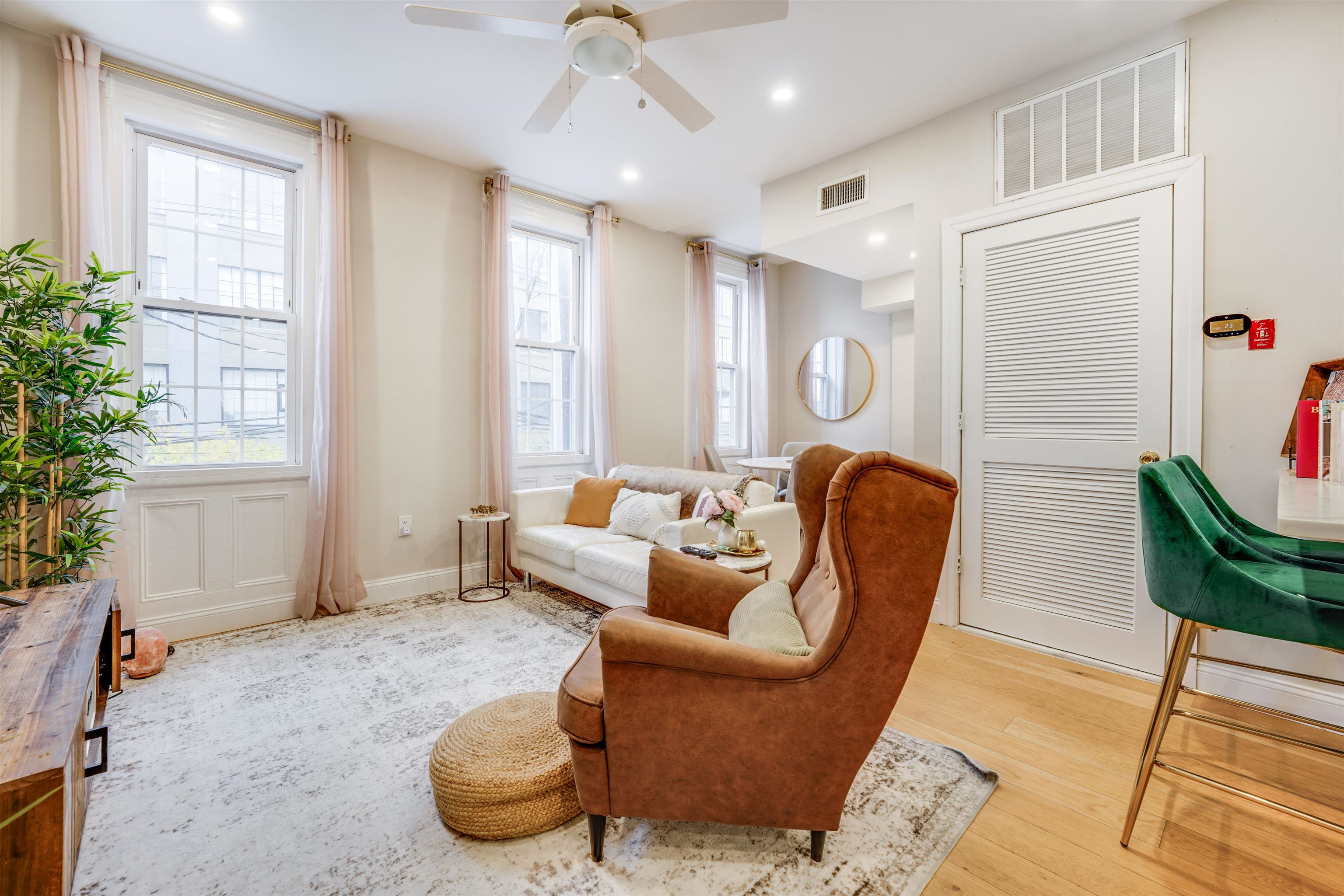 709 Monroe Street, Unit 2 Hoboken, NJ 07030 - Photo 3 of 22 a living room with furniture potted plant and a window