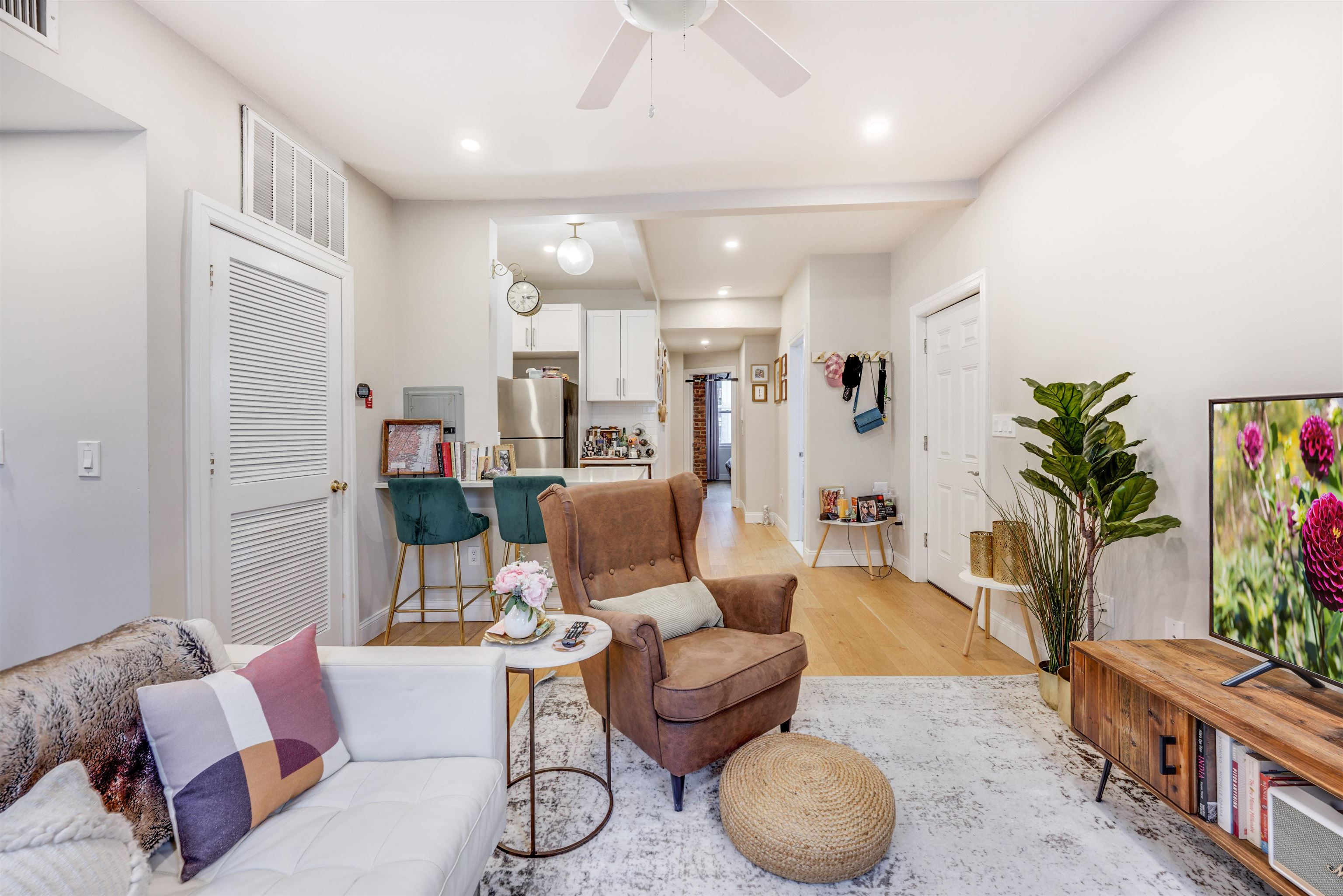 709 Monroe Street, Unit 2 Hoboken, NJ 07030 - Photo 5 of 22 a living room with furniture and a potted plant