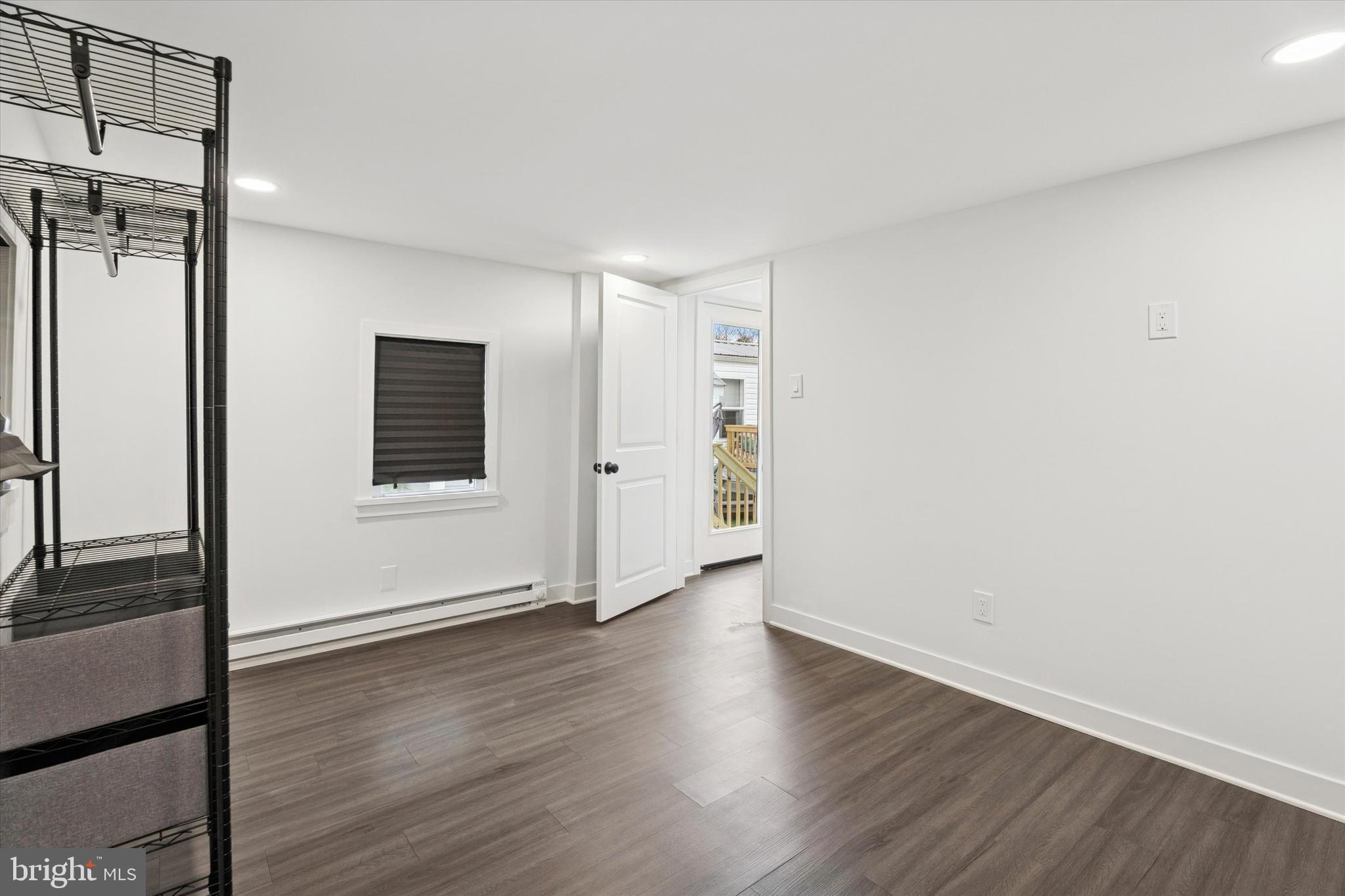 841 Cypress Ave Spring Spring City, PA 19475 - Photo 15 of 18 a view of an empty room with wooden floor and a window
