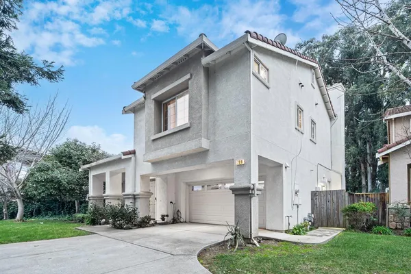 a front view of a house with a yard