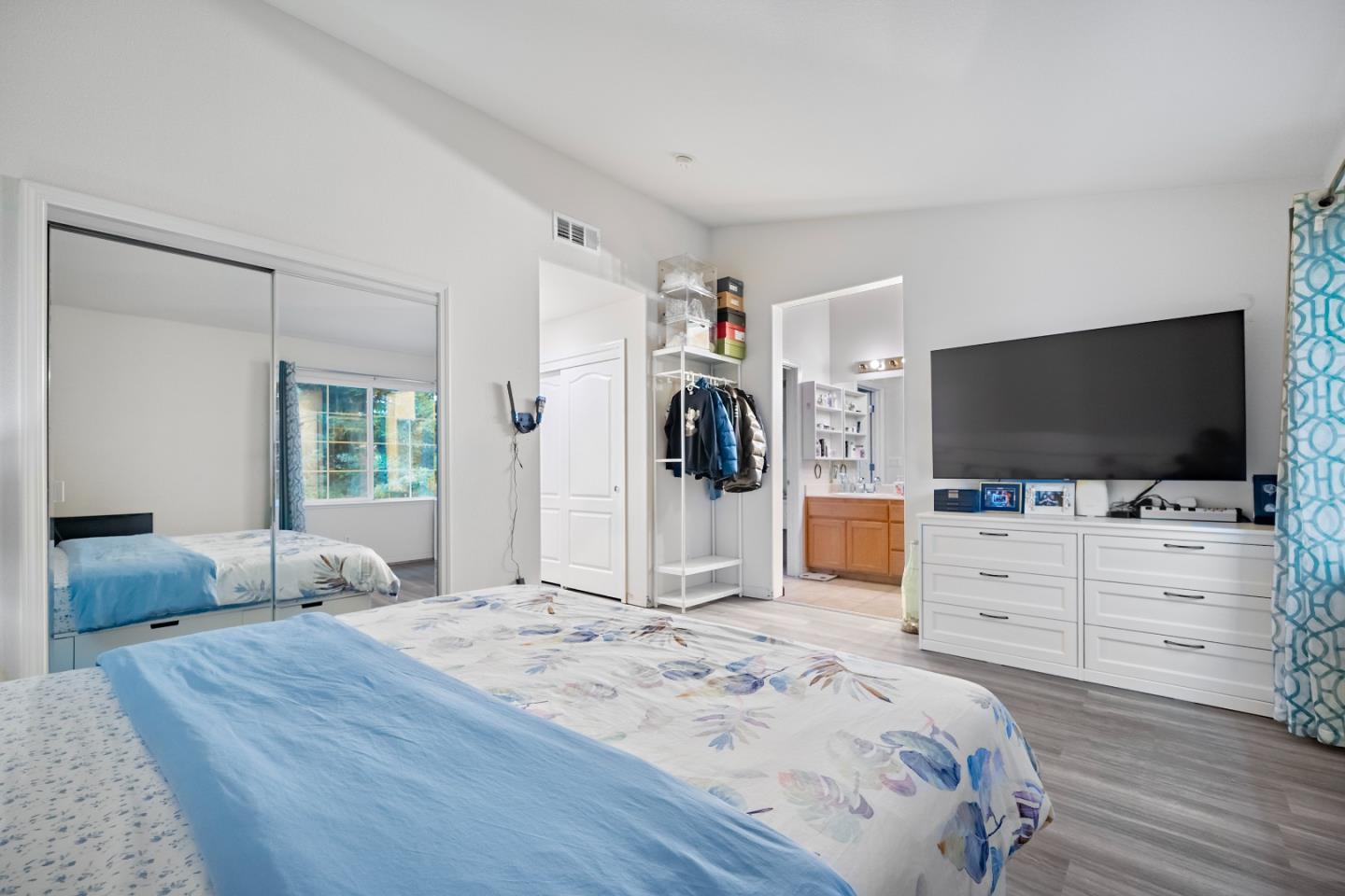 708 Raineer Court San Leandro, CA 94577 - Photo 16 of 32 a bedroom with a bed and flat screen tv