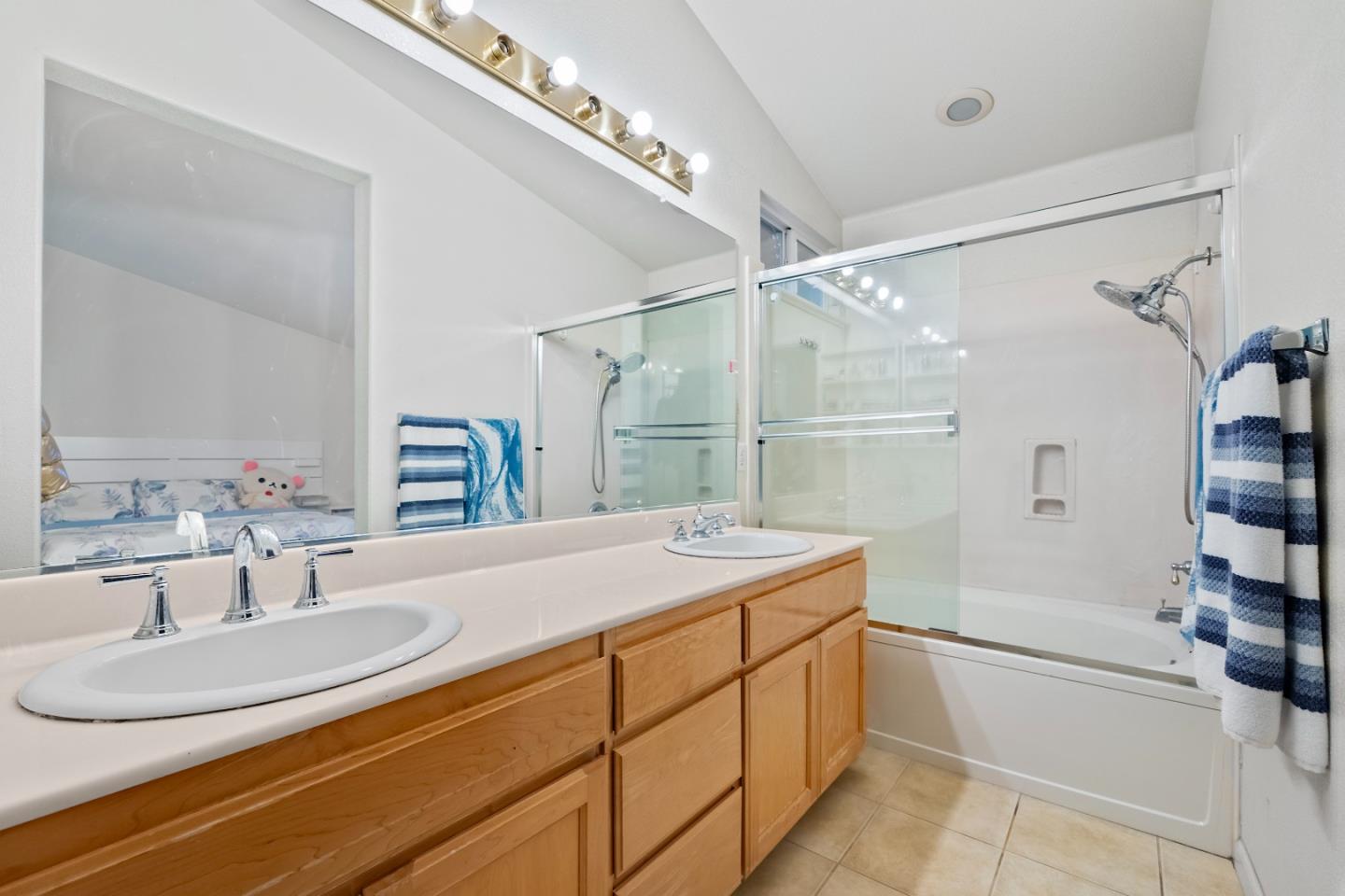 708 Raineer Court San Leandro, CA 94577 - Photo 17 of 32 a bathroom with a sink double vanity and a mirror