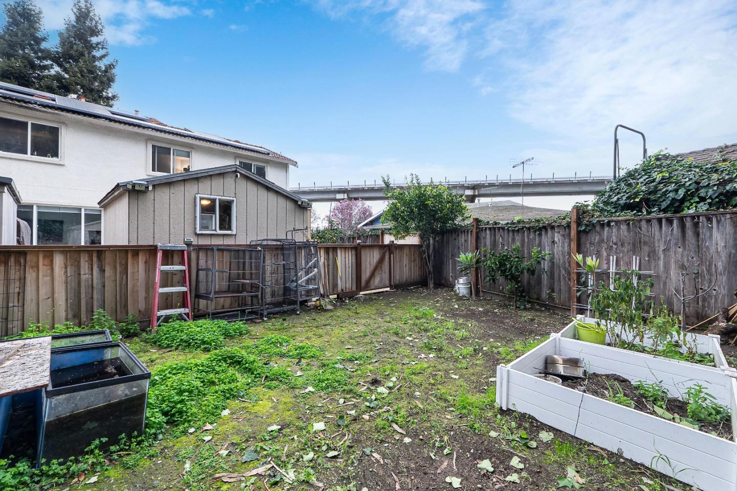 708 Raineer Court San Leandro, CA 94577 - Photo 32 of 32 a view of a house with backyard and wooden fence
