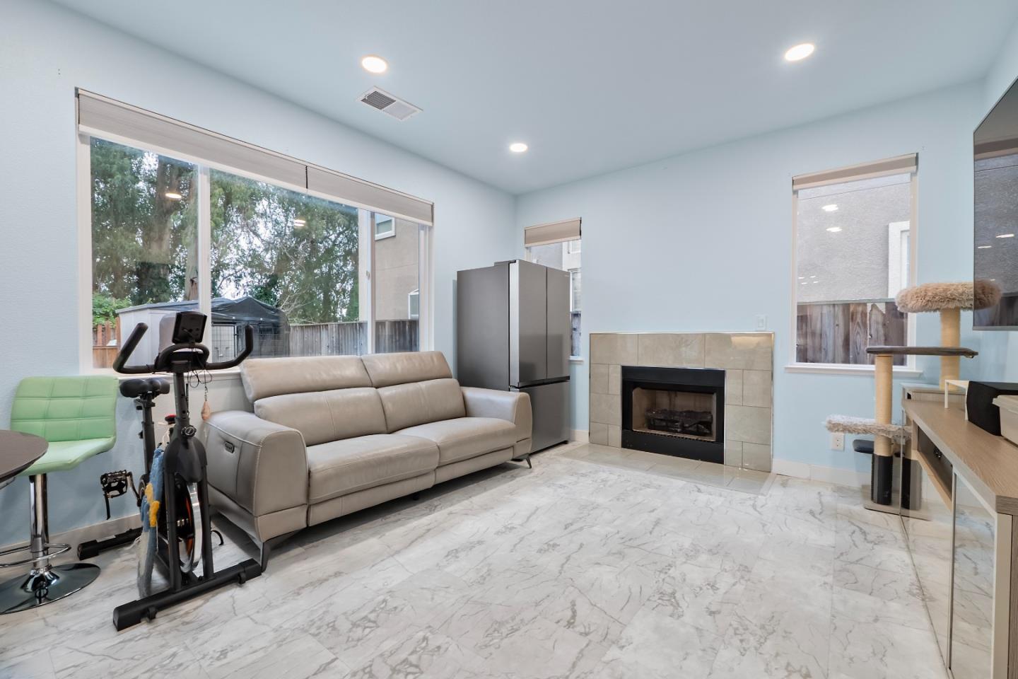 708 Raineer Court San Leandro, CA 94577 - Photo 9 of 32 a living room with furniture and a fireplace