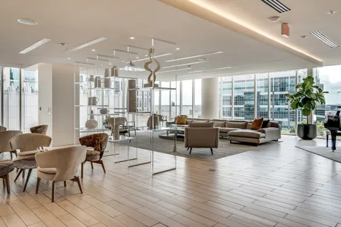 a dining room with furniture and wooden floor