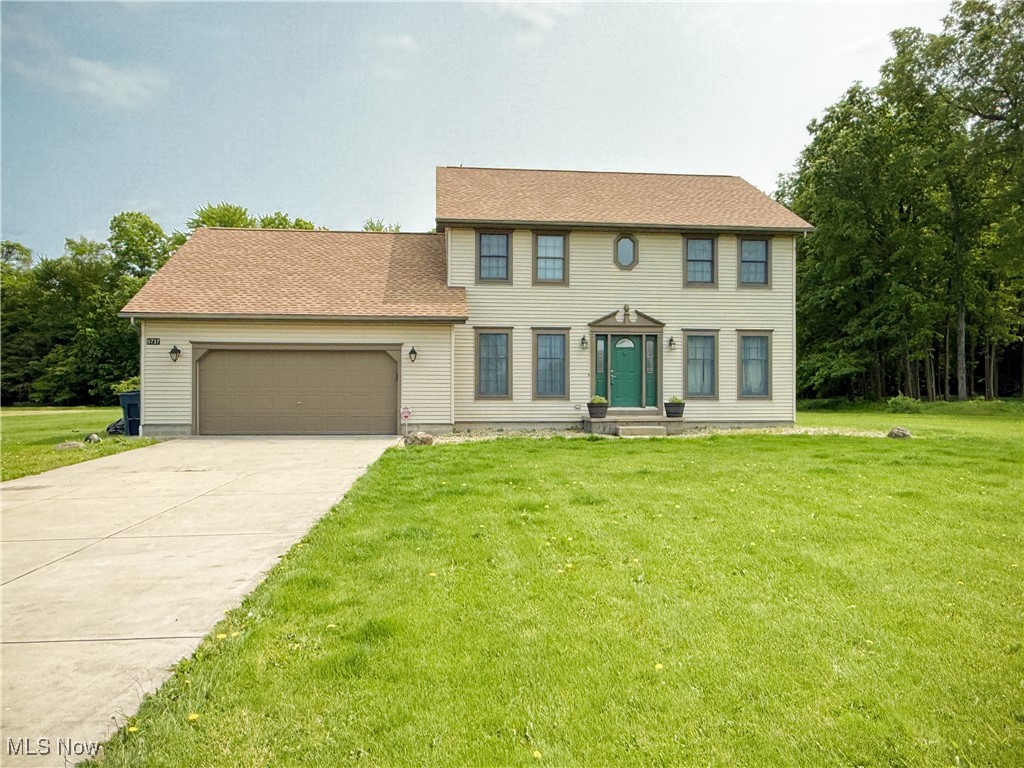 11737 Gladstone Road Warren, OH 44481 - Photo 41 of 41 Colonial inspired home with a garage, a front yard, and concrete driveway