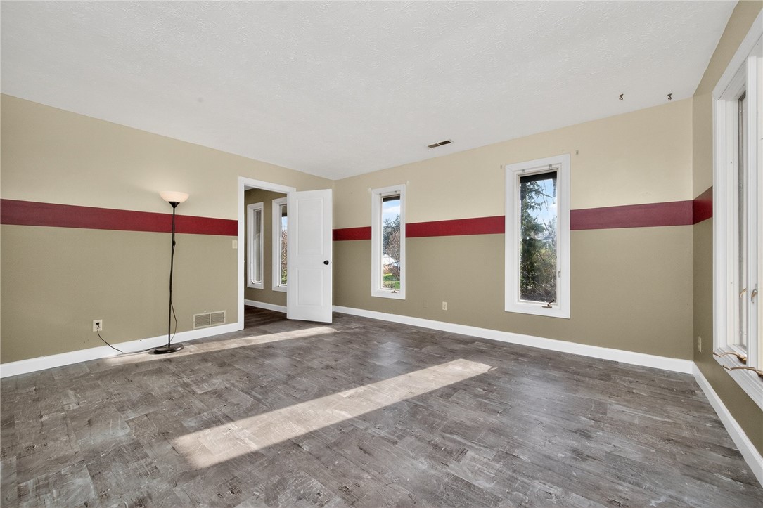 4747 Fawnwood Road Dayton, OH 45429 - Photo 49 of 58 This bright bedroom features durable flooring and multiple windows, creating a serene and inviting space.