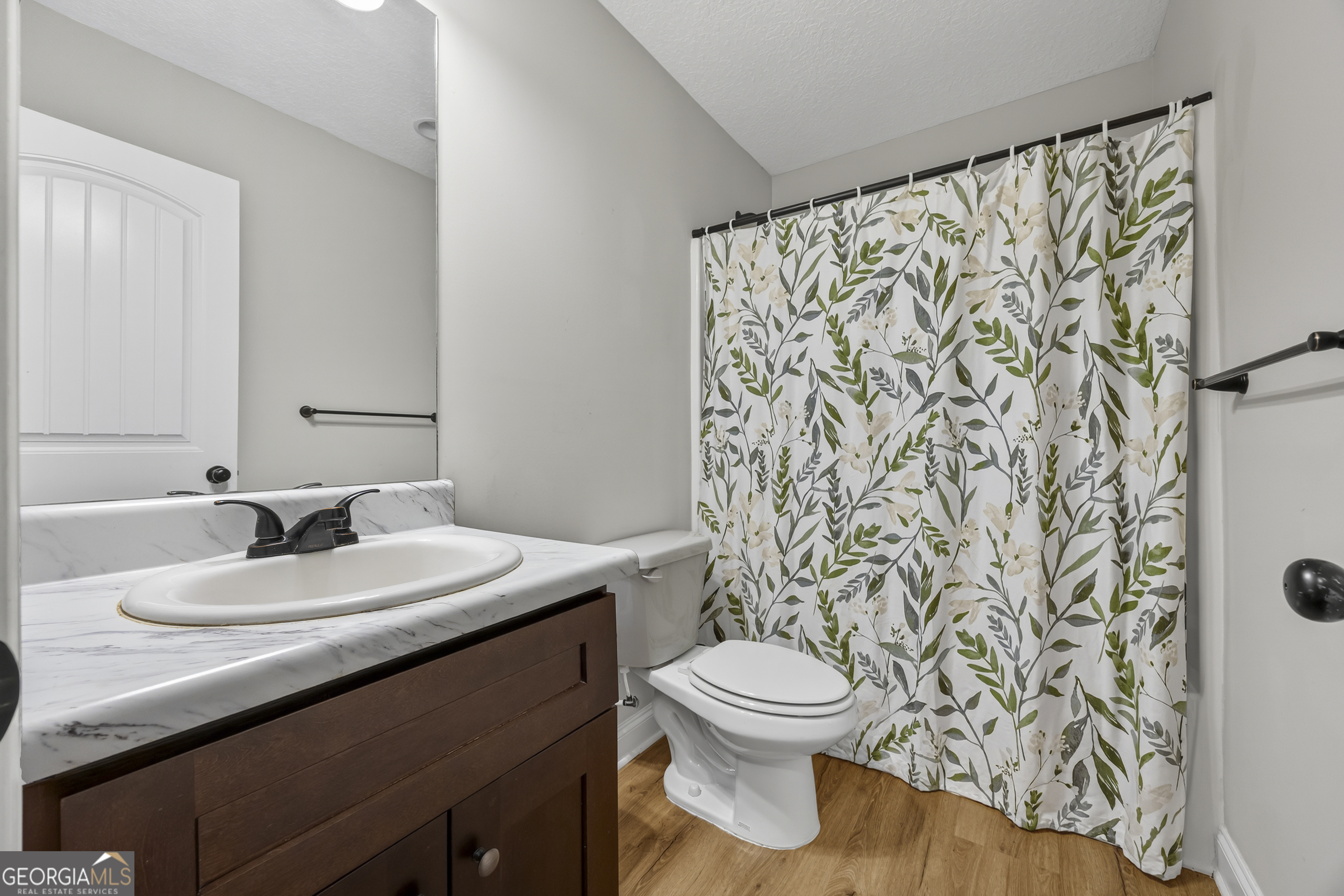 717 Oconee Lane Commerce, GA 30529 - Photo 37 of 57 a bathroom with a sink and a mirror