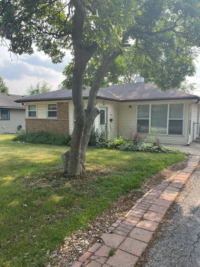 2713 Wilke Road Rolling Meadows, IL 60008 - Photo 7 of 9 a view of a house with a backyard