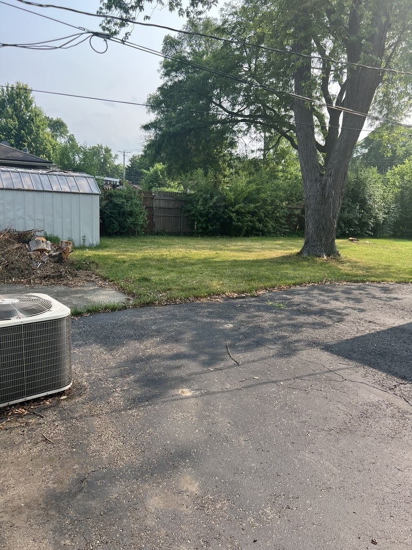 2713 Wilke Road Rolling Meadows, IL 60008 - Photo 9 of 9 a view of a yard with swimming pool and sitting area