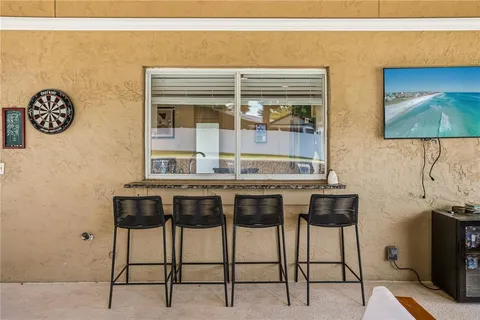a kitchen with a table and chairs