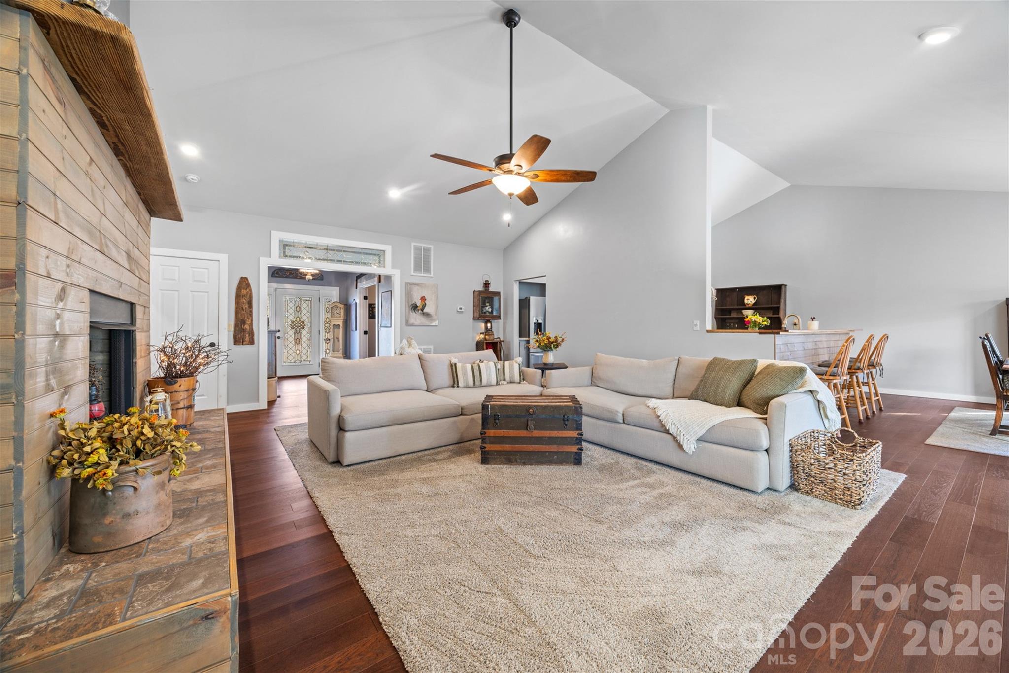 445 Warren Road Taylorsville, NC 28681 - Photo 15 of 48 a living room with furniture kitchen view and a chandelier
