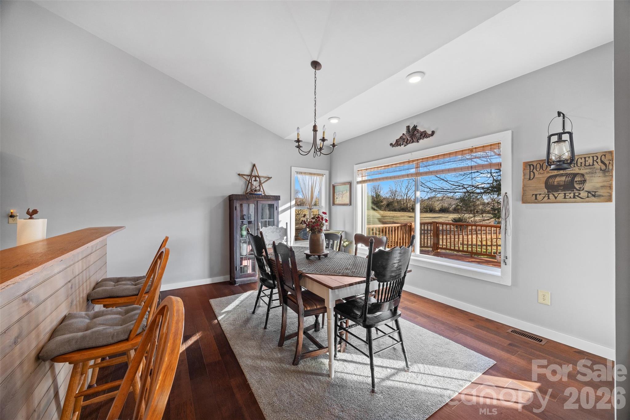 445 Warren Road Taylorsville, NC 28681 - Photo 16 of 48 a view of a dining room with furniture window and wooden floor
