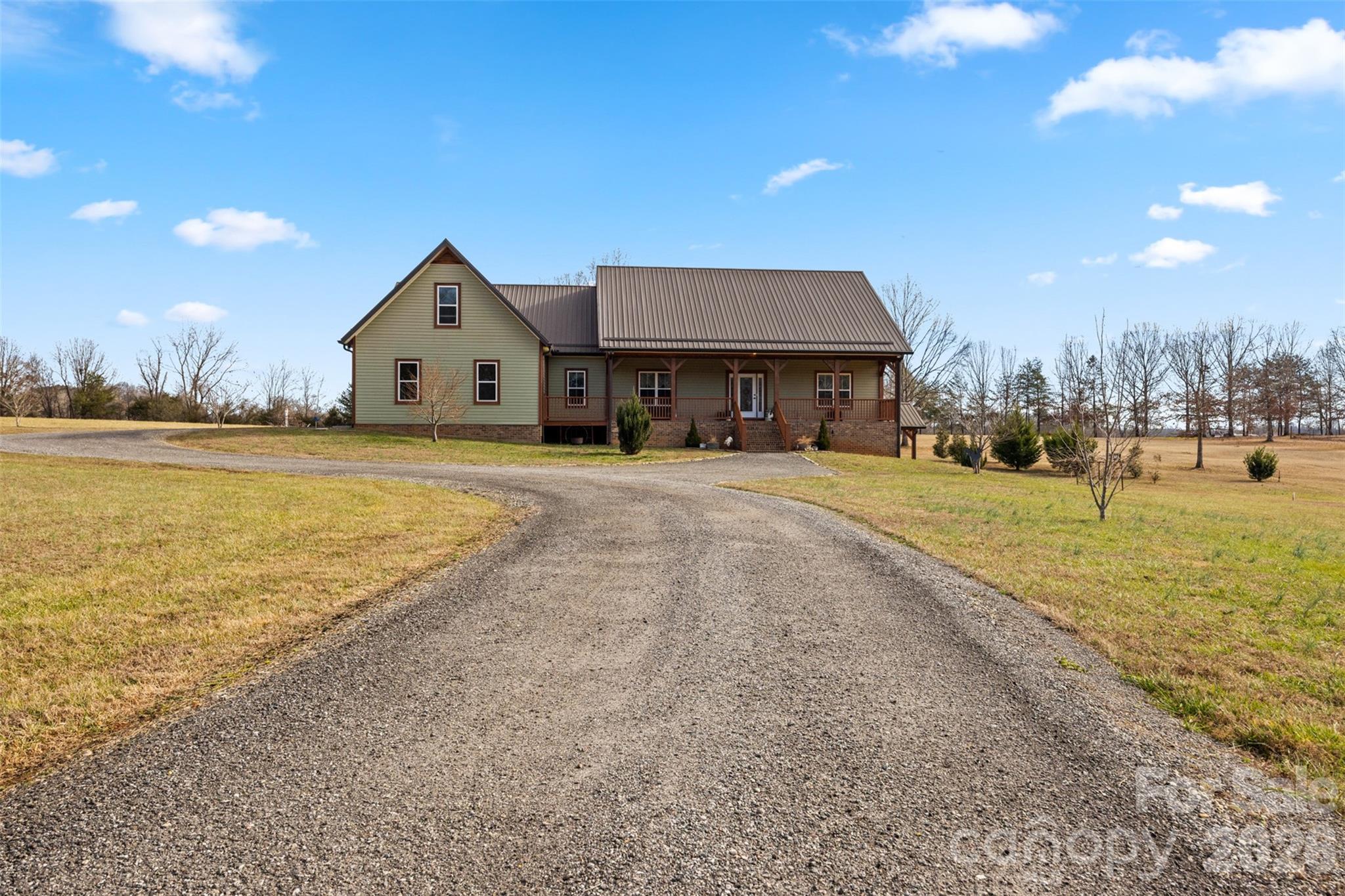 445 Warren Road Taylorsville, NC 28681 - Photo 2 of 48 a view of a house with a yard and a large tree