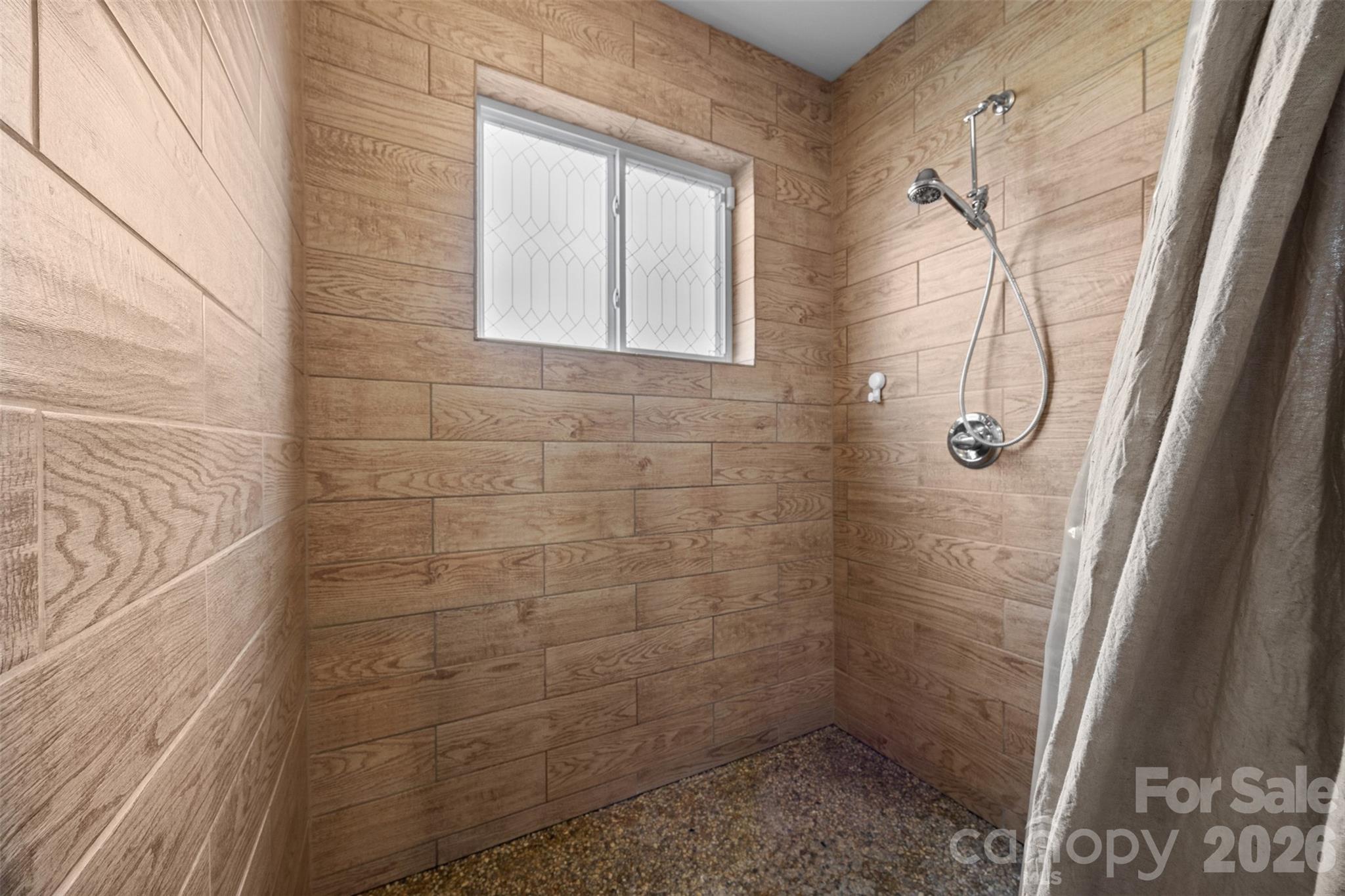 445 Warren Road Taylorsville, NC 28681 - Photo 29 of 48 a bathroom with a glass shower door