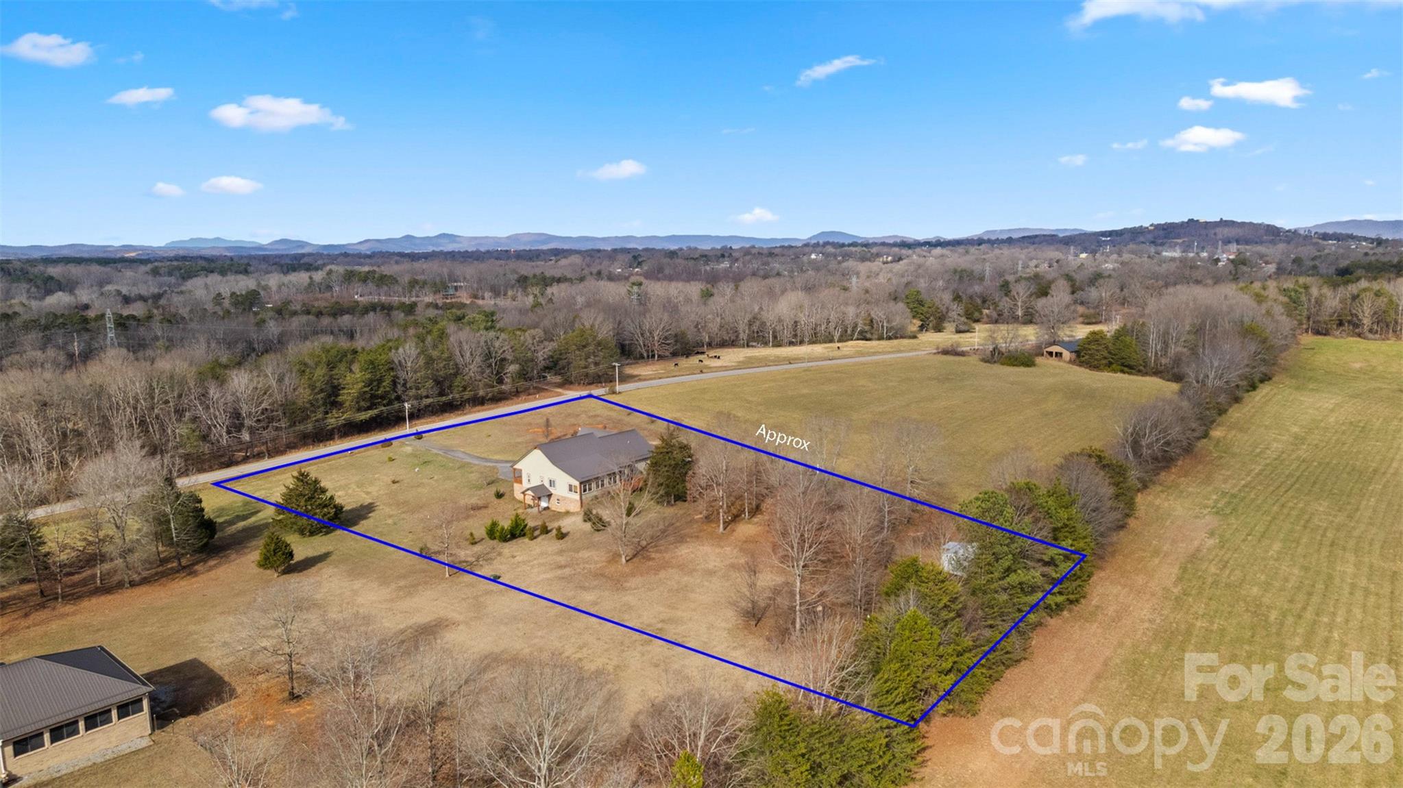 445 Warren Road Taylorsville, NC 28681 - Photo 3 of 48 a view of a back yard from a balcony
