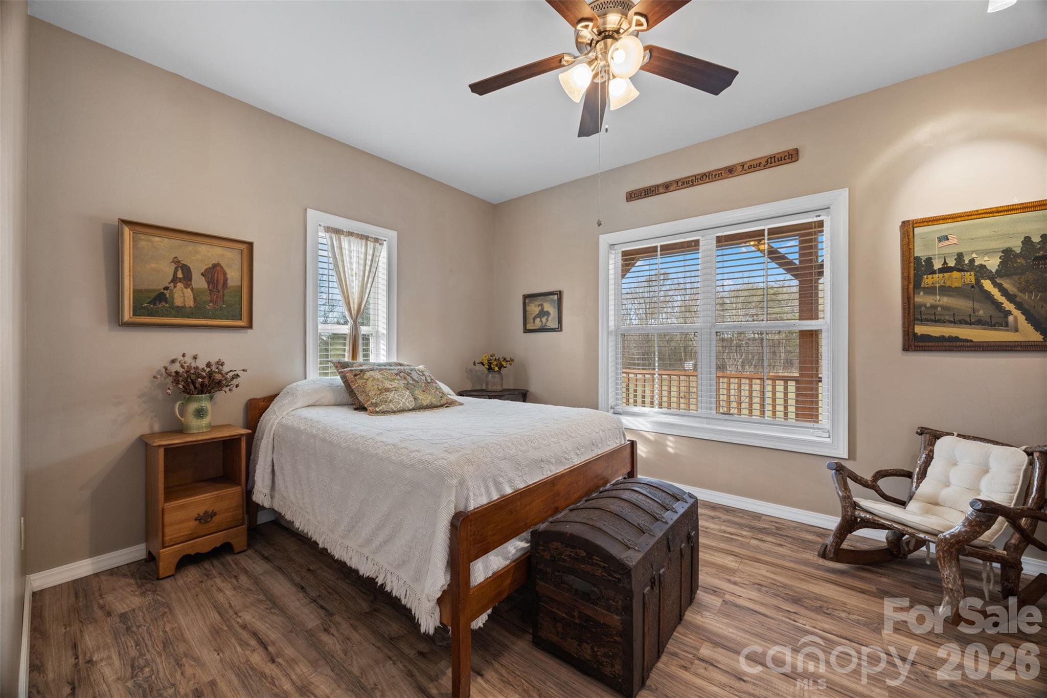 445 Warren Road Taylorsville, NC 28681 - Photo 31 of 48 a bedroom with a bed and wooden floor