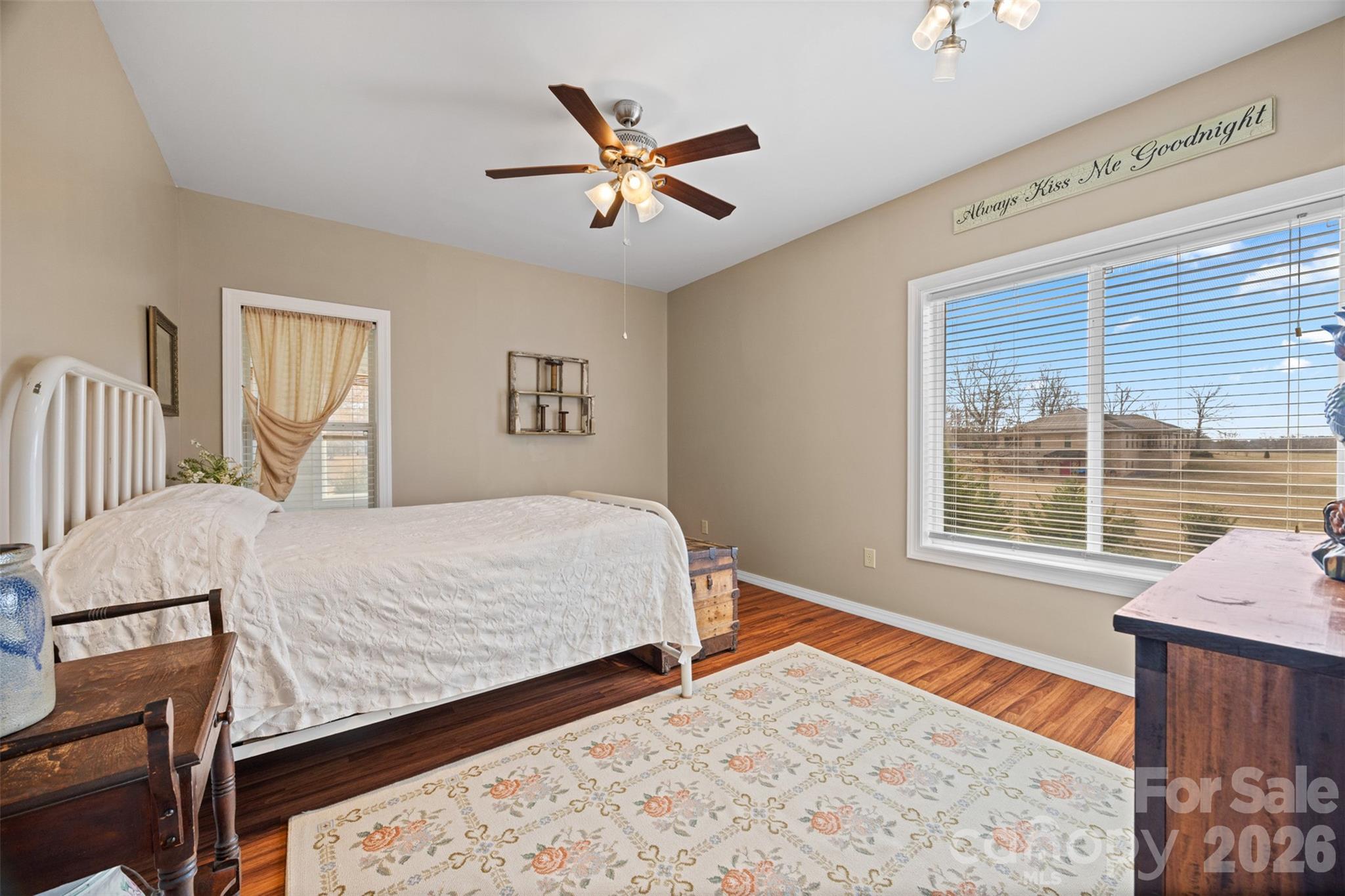 445 Warren Road Taylorsville, NC 28681 - Photo 34 of 48 a bedroom with a bed and wooden floor